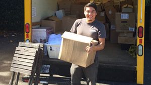 man carries box